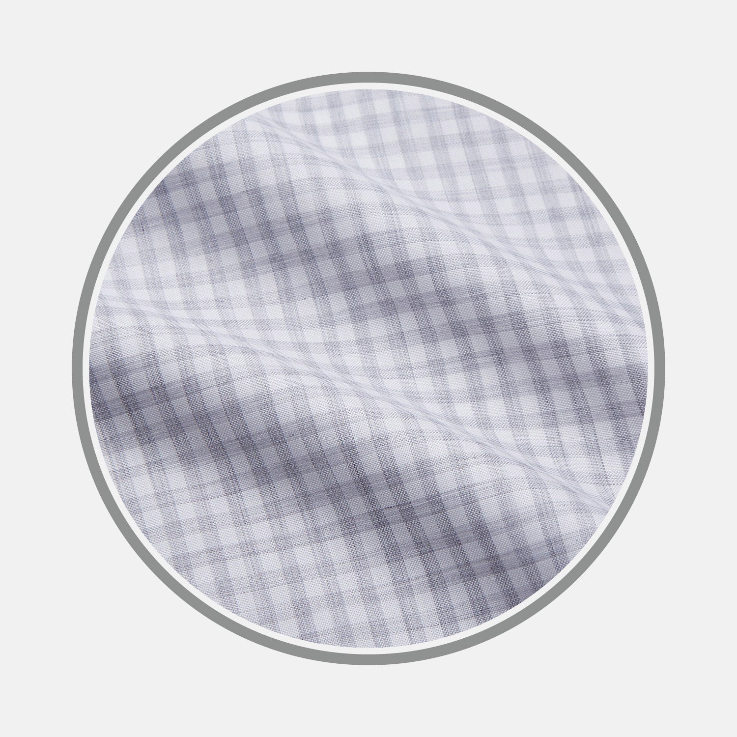 View 1 of product Close-up of Turnbull & Asser’s Grey Check Cotton Fabric, featuring a light gray and white plaid pattern in a circular frame that highlights the smooth texture and crisp intersecting lines.