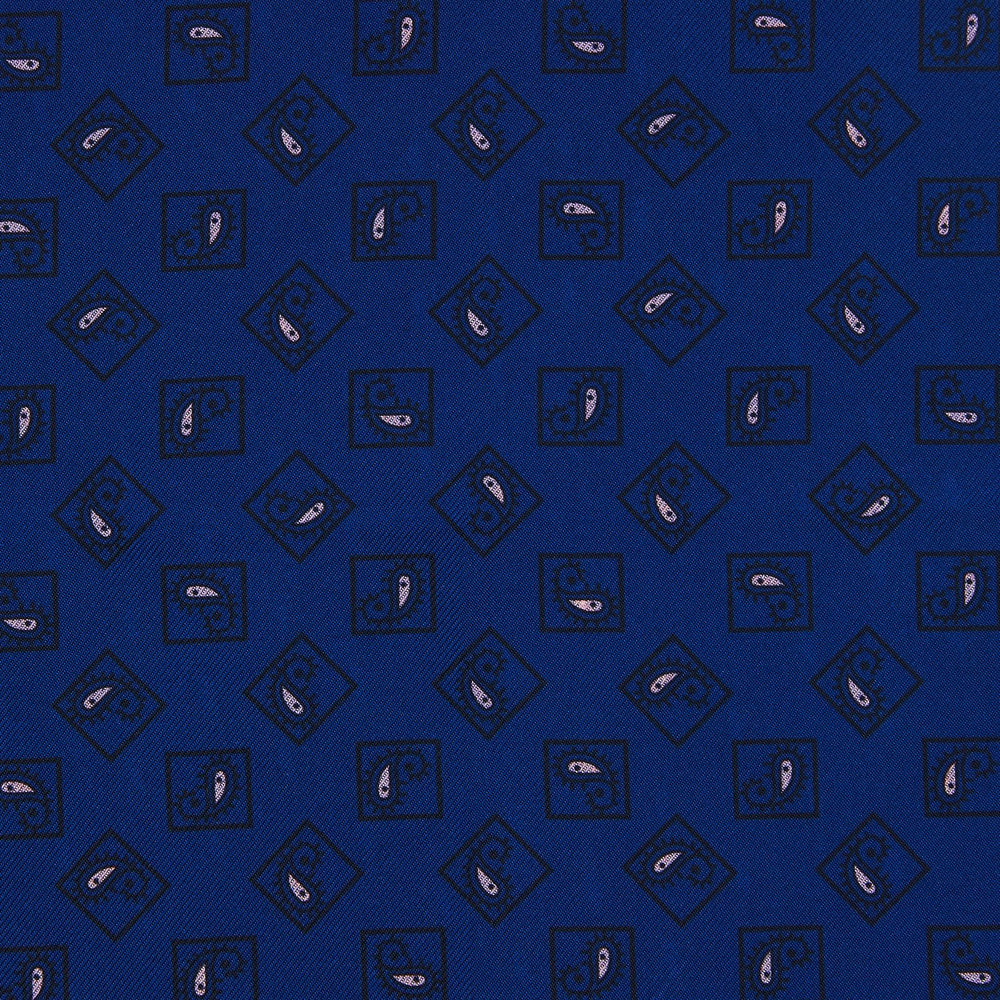 A pink and navy double-faced paisley silk bandana pocket square from Turnbull & Asser, featuring digitally printed designs with brand name in the corner.