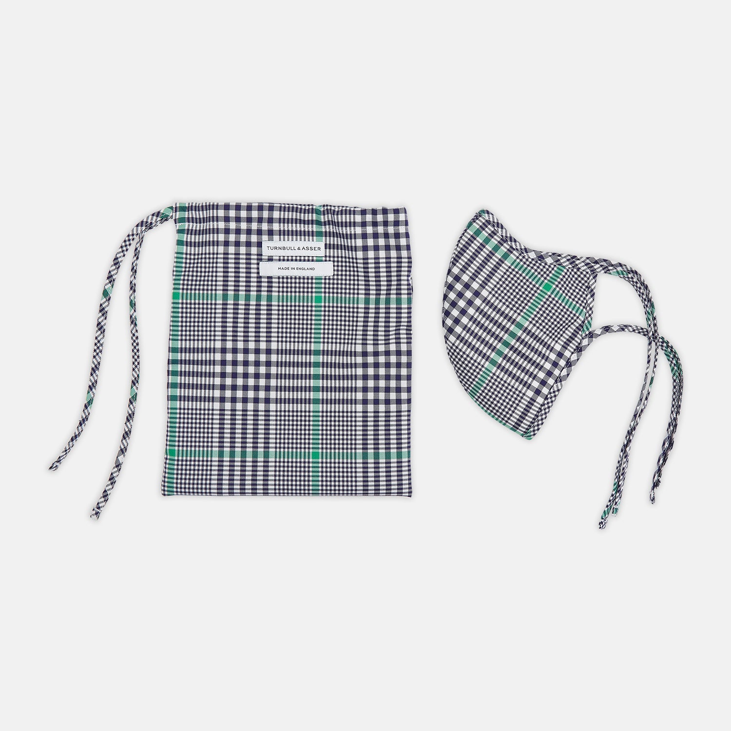 View 2 of product The Turnbull & Asser Exclusive Navy & Green Archive Check Superfine Cotton Commuter Mask features adjustable ear loops with bows and comes with 3 Viroformula™ filters.