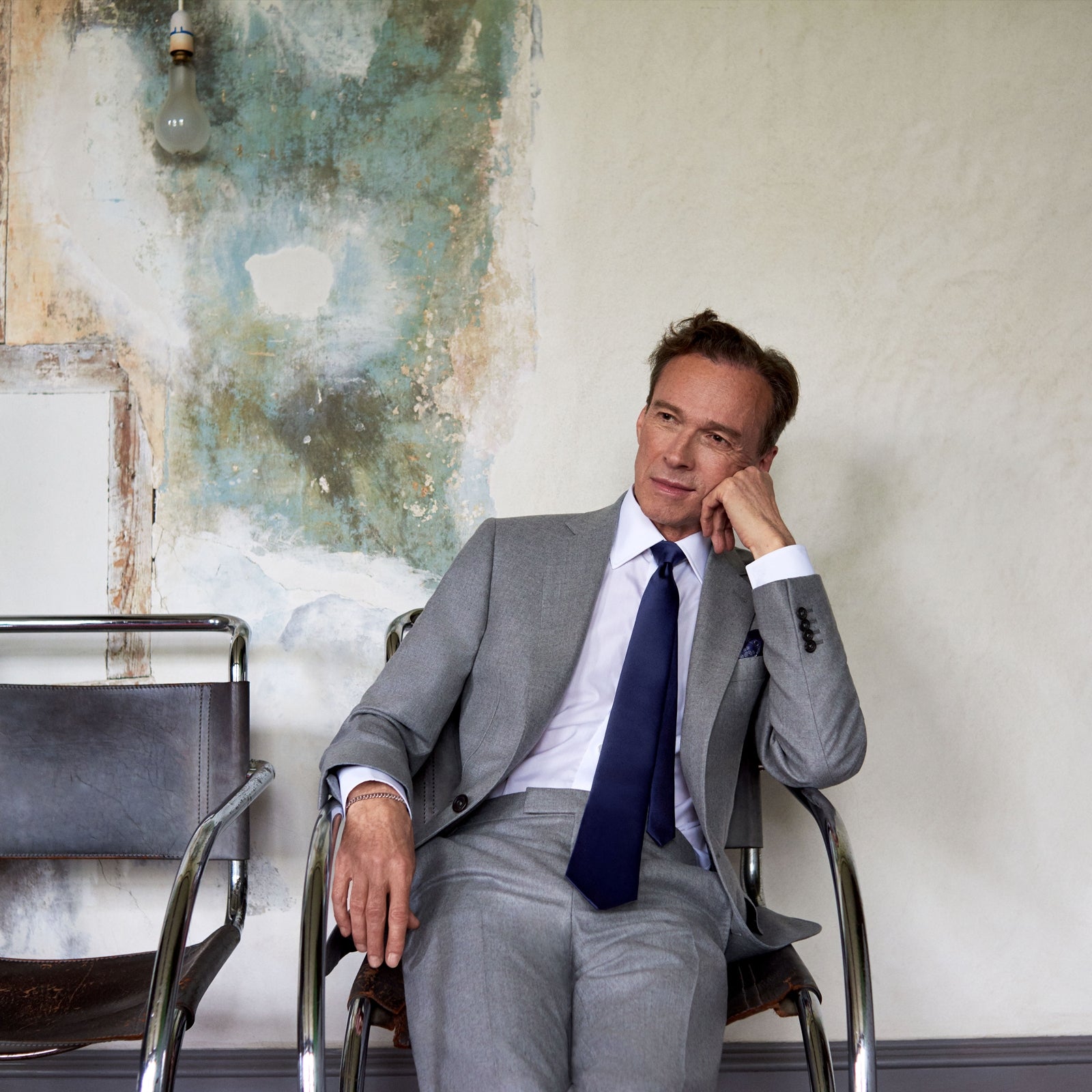 View 3 of product The Dove Grey Escorial Lightweight Wool Jacket by Turnbull & Asser features soft Escorial wool, a notched lapel, two front buttons, three pockets, and a single chest pocket, shown against a plain white background.