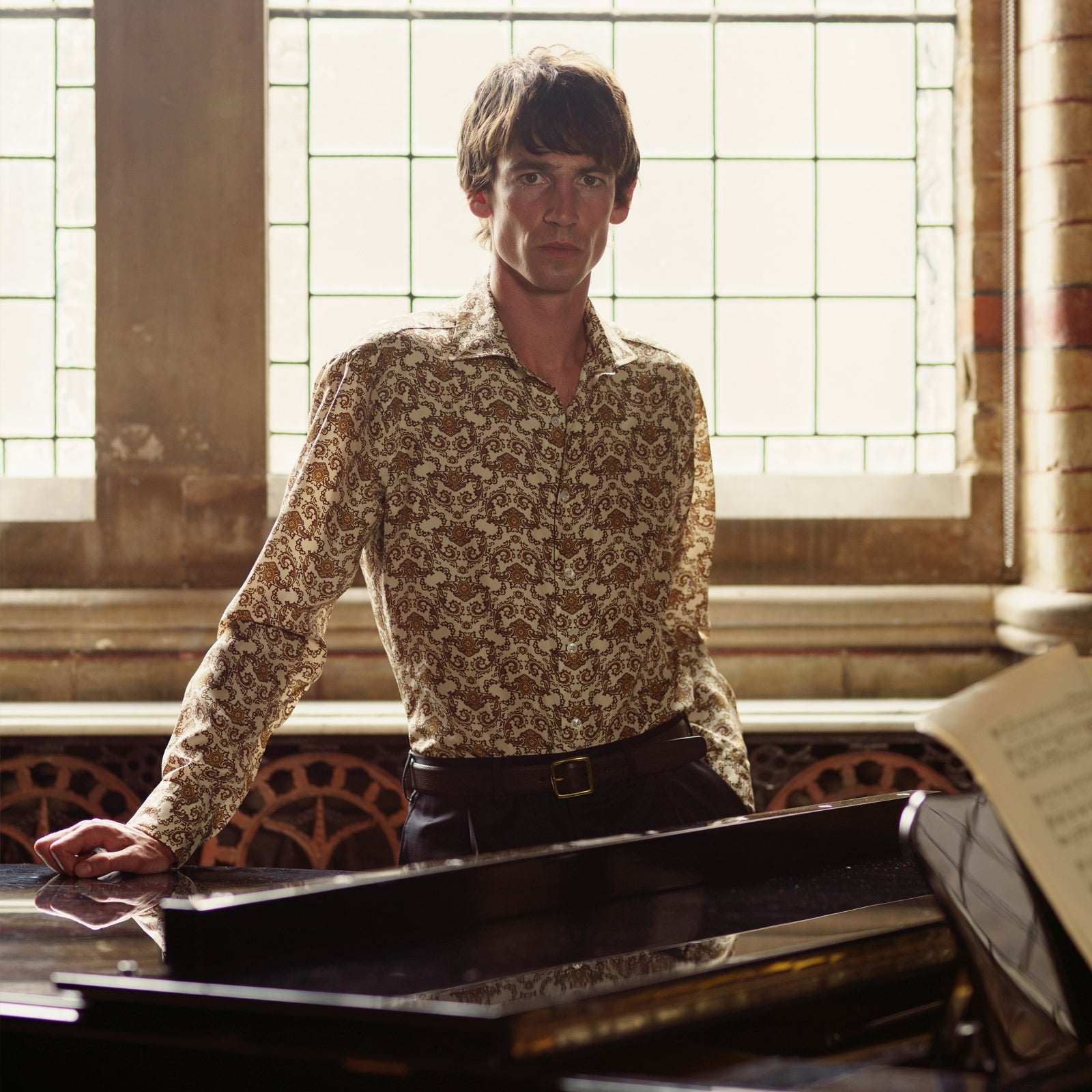 View 2 of product The Turnbull & Asser Tailored Fit Cream Jagger Print Silk Shirt features a Kent collar, 2-button cuffs, and an intricate brown and gold print on cream silk for timeless elegance.