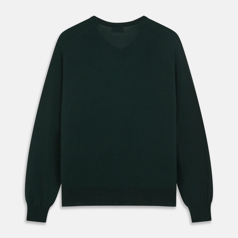The Turnbull & Asser Forest Green Fine Merino V-Neck Jumper, shown laid flat on a white background, features classic Scottish knitwear details with ribbed cuffs and hem for a timeless look.
