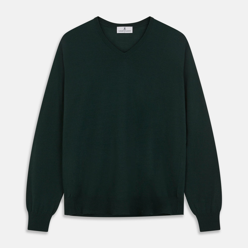 The Turnbull & Asser Forest Green Fine Merino V-Neck Jumper, shown laid flat on a white background, features classic Scottish knitwear details with ribbed cuffs and hem for a timeless look.