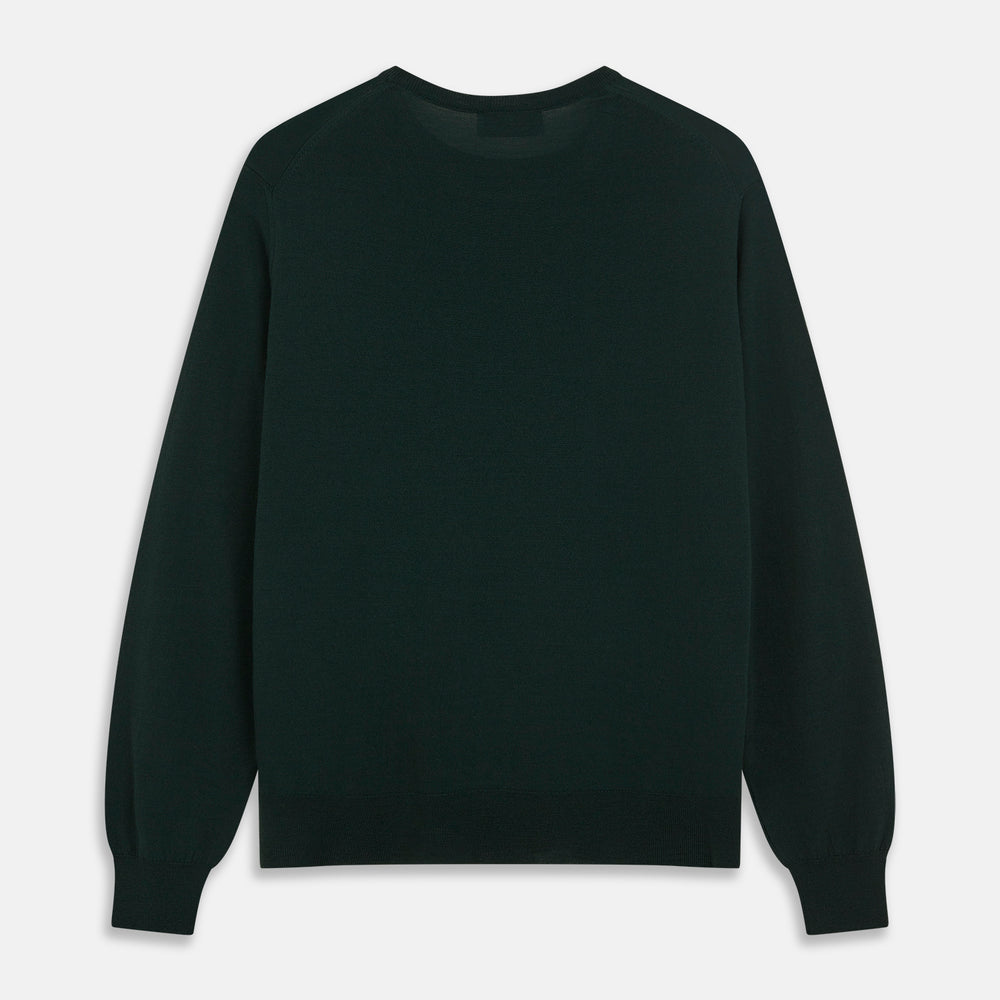 The Turnbull & Asser Forest Green Crew Neck Merino Jumper features ribbed cuffs and hem for a classic look. Laid flat on a white background, this luxury long-sleeve sweater is an essential, timeless addition to any wardrobe.