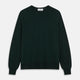 The Turnbull & Asser Forest Green Crew Neck Merino Jumper features ribbed cuffs and hem for a classic look. Laid flat on a white background, this luxury long-sleeve sweater is an essential, timeless addition to any wardrobe.