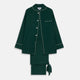 The Turnbull & Asser Dark Green Silk Pyjama Set features a long-sleeve button-up top with white piping, chest pocket, and matching pants, all neatly folded on a plain white background.