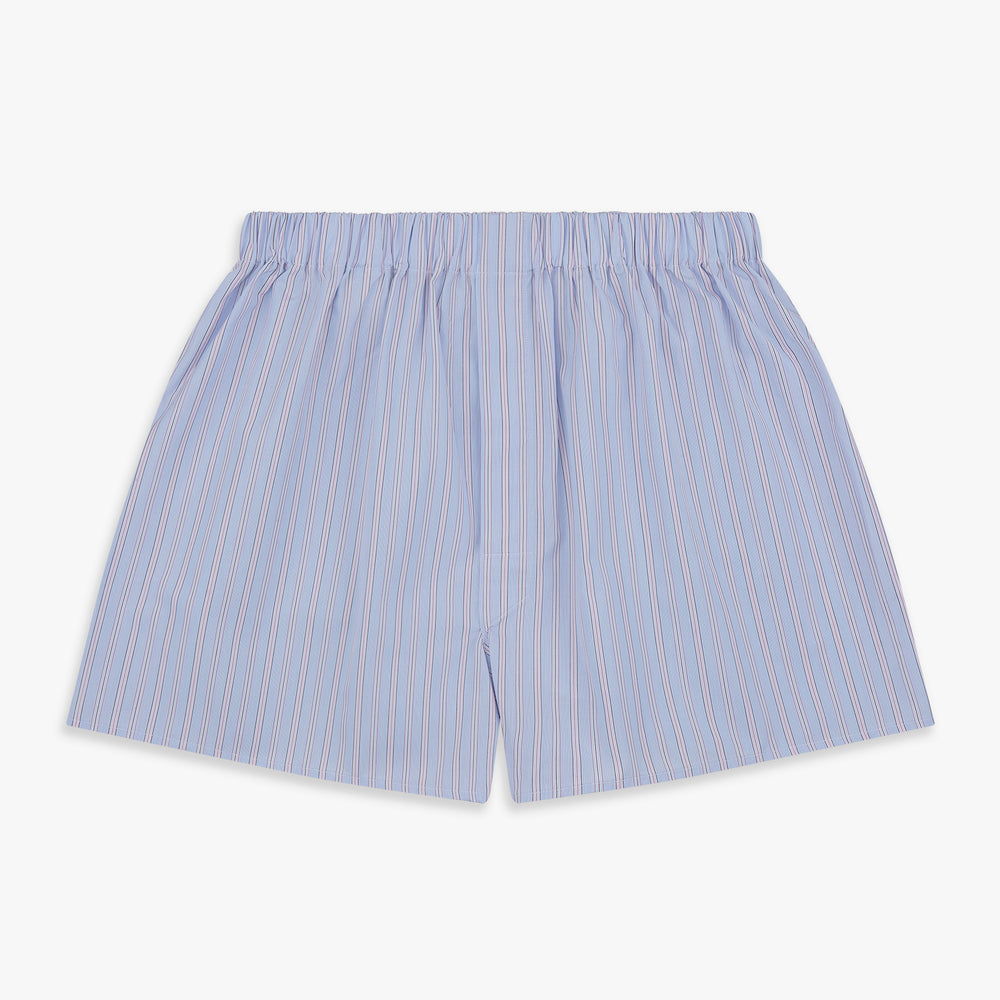 Turnbull & Asser's Blue and Pink Stripe Poplin Cotton Boxer Shorts feature an elastic waistband, loose fit, and thin pink and blue vertical stripes, shown here against a plain white background.