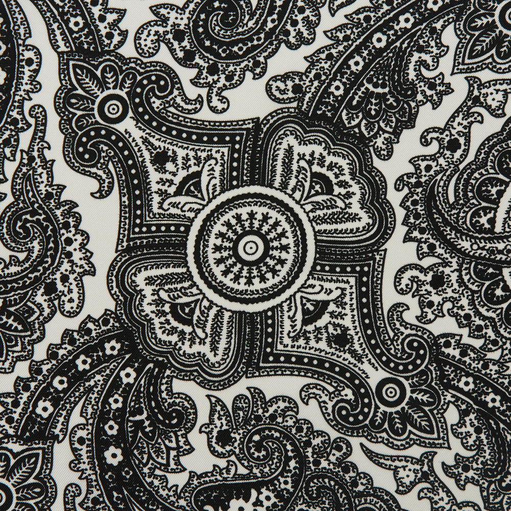 The White Persian Paisley Pocket Square by Turnbull & Asser features a refined black paisley and floral pattern with a decorative border, making it a sophisticated, festive gift.