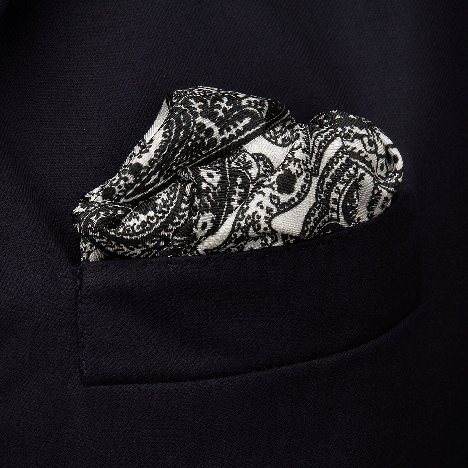 View 3 of product The White Persian Paisley Pocket Square by Turnbull & Asser features a refined black paisley and floral pattern with a decorative border, making it a sophisticated, festive gift.