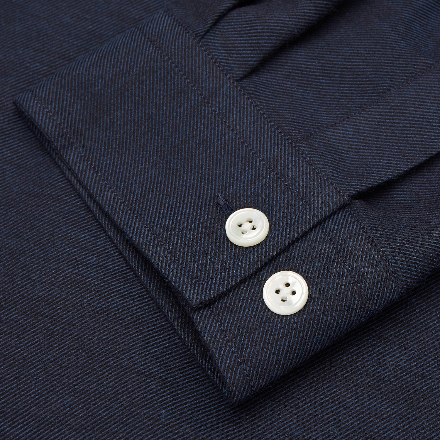 View 3 of product The Turnbull & Asser Holiday Fit Navy Cotton and Cashmere Blend Shirt features 1-button cuffs, a notched collar, and a single chest pocket, shown against a plain white background.