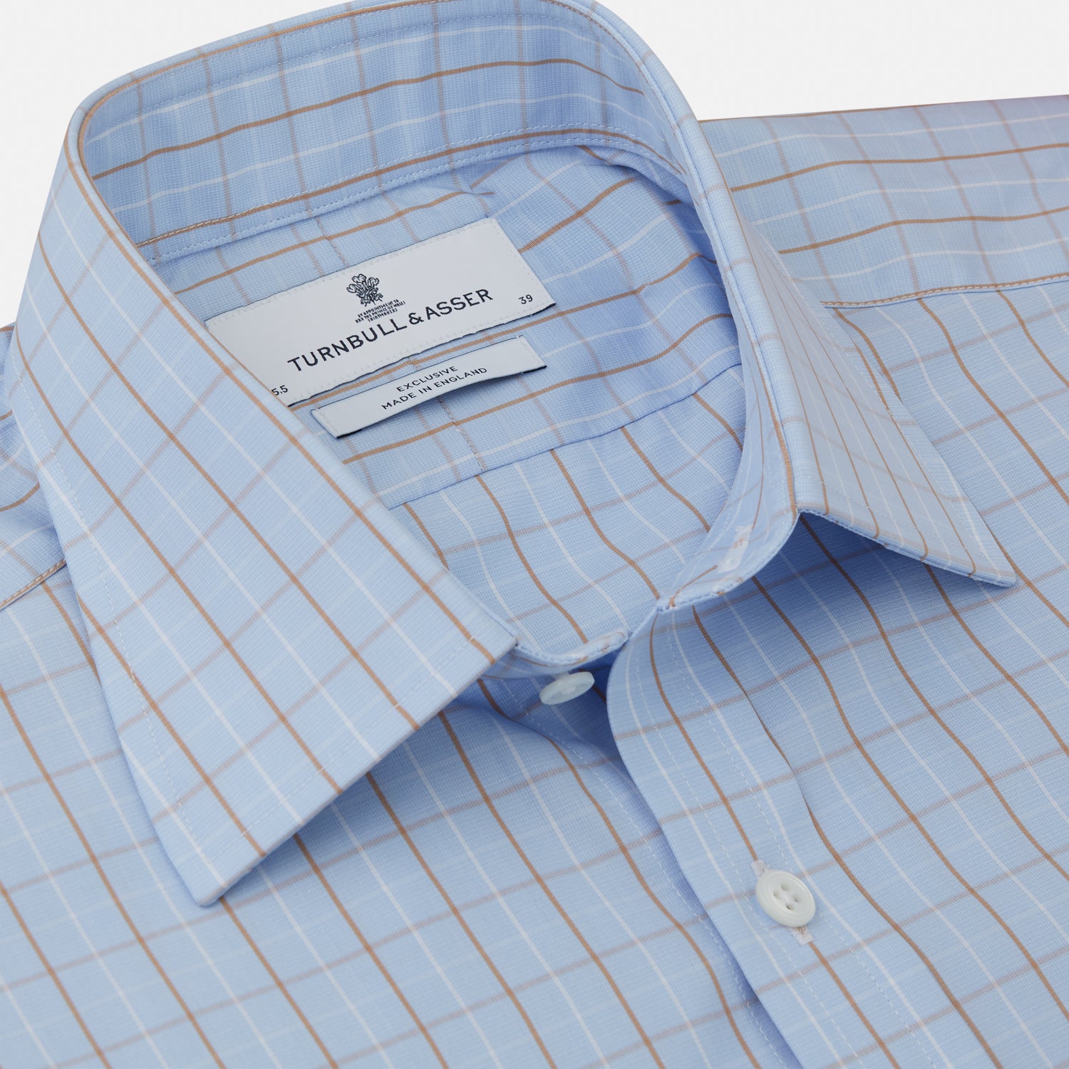 View 2 of product A beige graph check regular fit shirt by Turnbull & Asser, featuring a T&A collar and 3-button cuffs, is neatly laid flat on a white background.