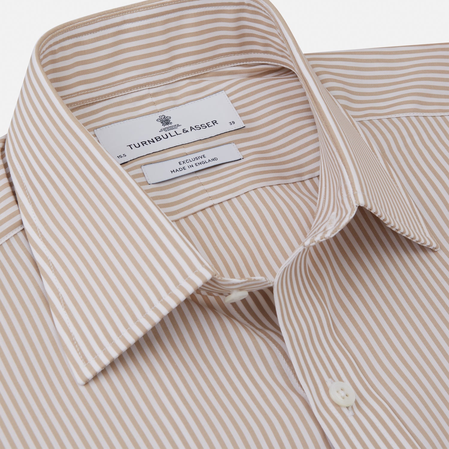 View 2 of product The Turnbull & Asser Sand Bengal Stripe Regular Fit Shirt features thin sand stripes, a T&A collar, and 3-button cuffs. Shown laid flat on a white background.