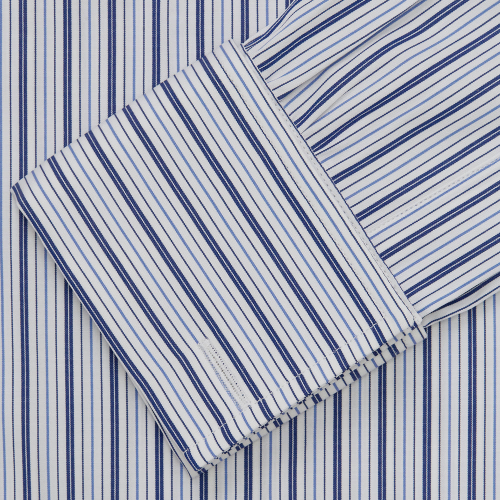 The Turnbull & Asser Navy Stripe Regular Fit Shirt features a T&A collar, square double cuffs, and thin vertical navy stripes on white.