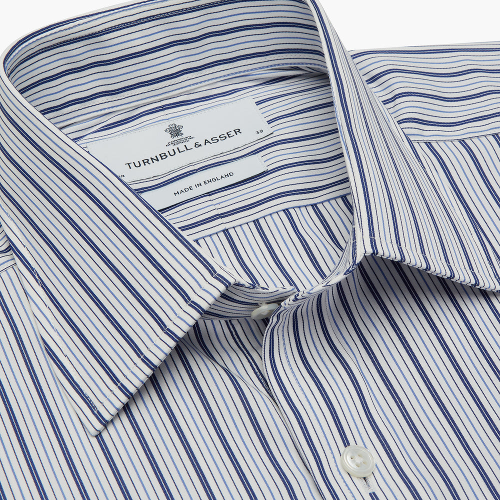 The Turnbull & Asser Navy Stripe Regular Fit Shirt features a T&A collar, square double cuffs, and thin vertical navy stripes on white.
