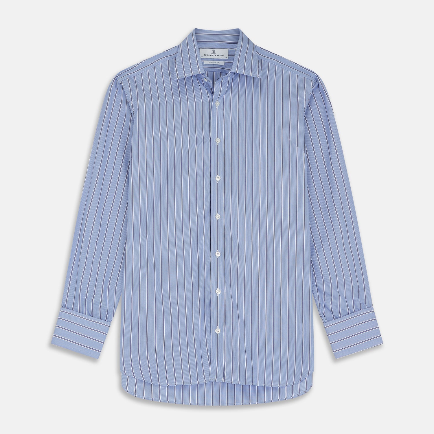 View 1 of product A neatly folded Turnbull & Asser Blue Stripe Regular Fit Shirt with T&A collar and square double cuffs, featuring long sleeves and thin white stripes on a light blue base, displayed on a plain white background.