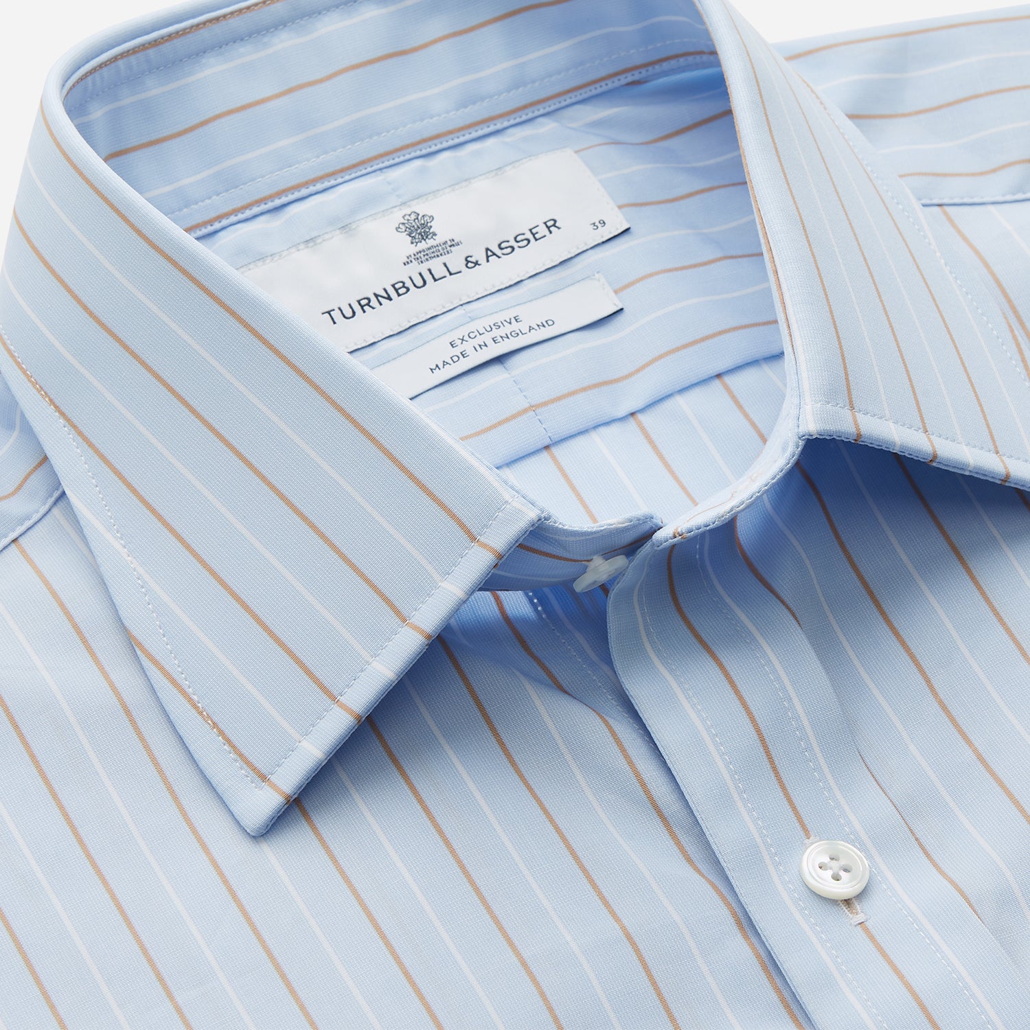 View 2 of product Turnbull & Asser Beige Stripe Regular Fit Shirt with T&A collar and double cuffs, featuring white buttons and laid flat on a white background.