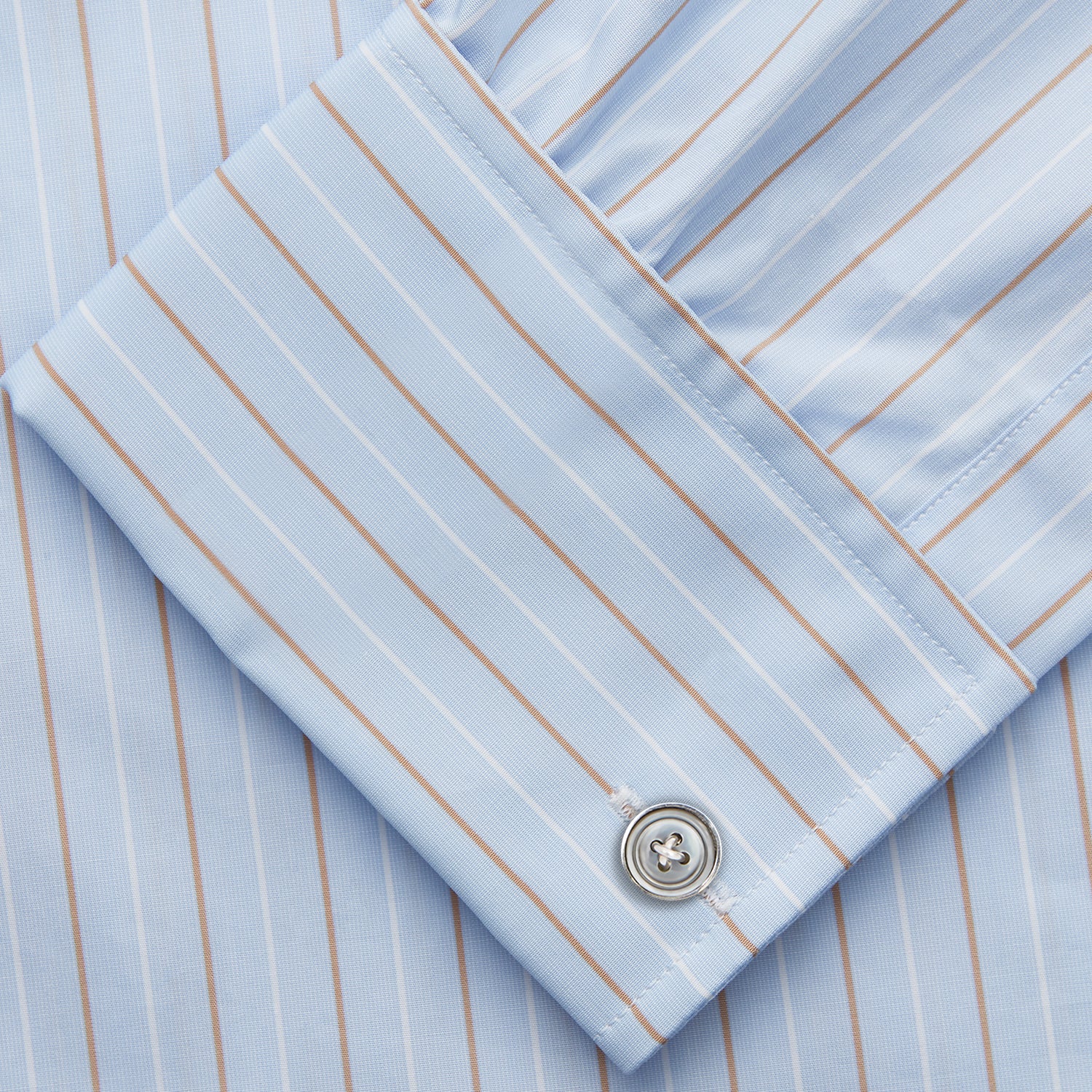 View 3 of product Turnbull & Asser Beige Stripe Regular Fit Shirt with T&A collar and double cuffs, featuring white buttons and laid flat on a white background.
