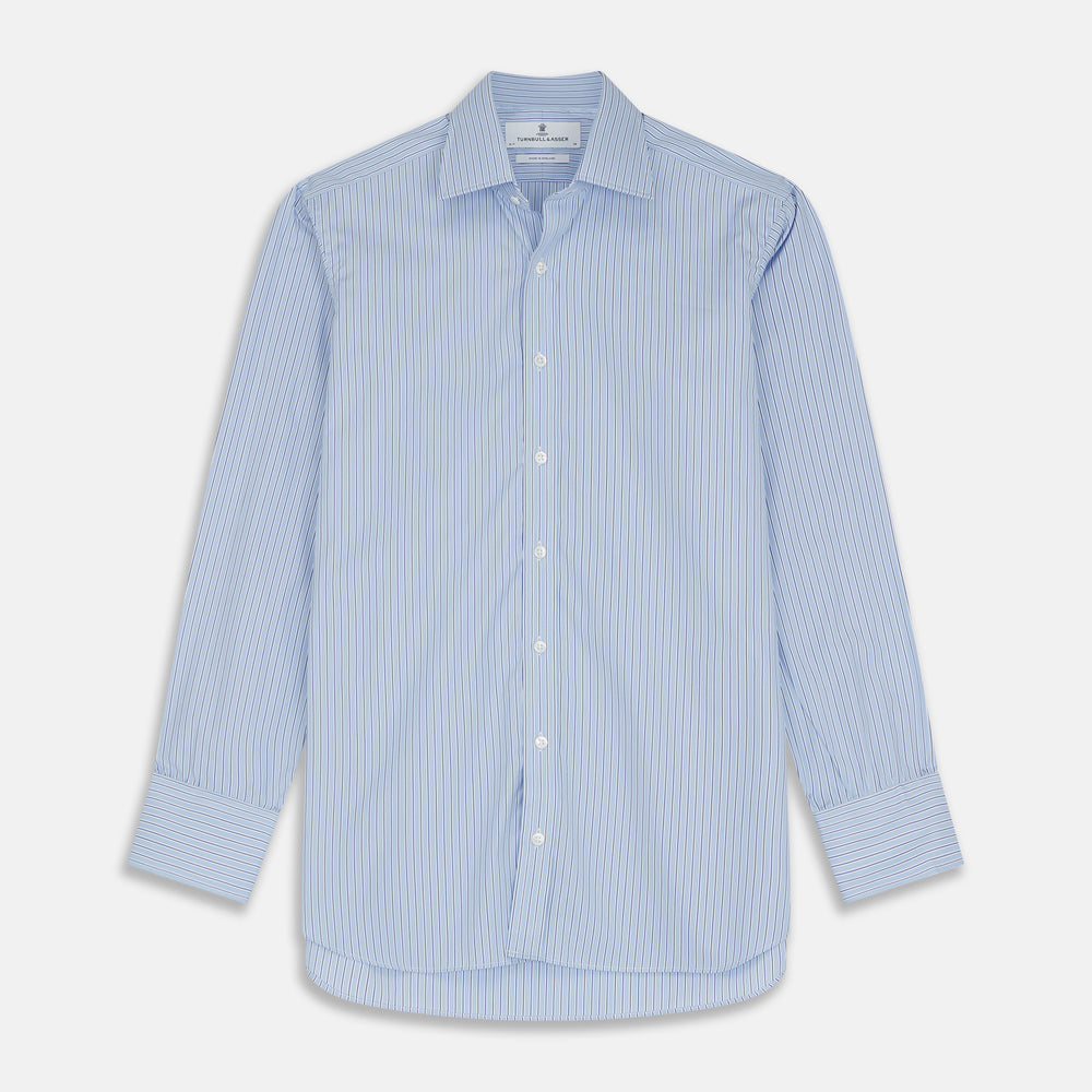 Turnbull & Asser’s Blue Stripe Shirt features thin vertical white stripes, a T&A collar, 3-button cuffs, white buttons, and a regular fit. Smart-casual style displayed flat on a white background.
