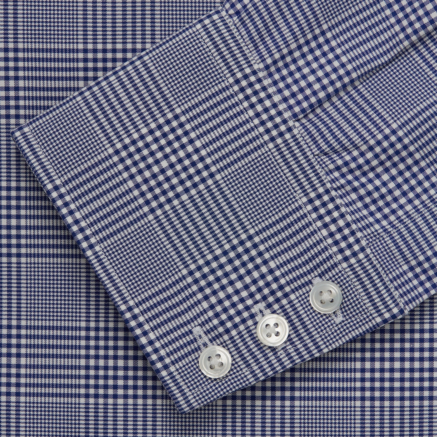 View 5 of product The Turnbull & Asser Navy Check Shirt, featuring a T&A collar and 3-button cuffs, is displayed on a white background.