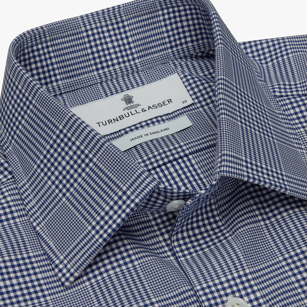 The Turnbull & Asser Navy Check Shirt, featuring a T&A collar and 3-button cuffs, is displayed on a white background.