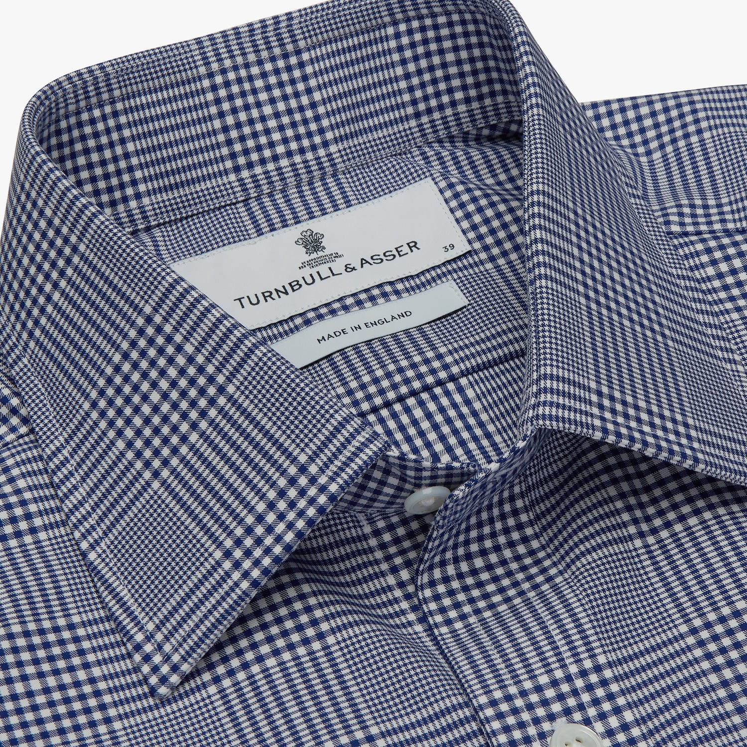 View 4 of product The Turnbull & Asser Navy Check Shirt, featuring a T&A collar and 3-button cuffs, is displayed on a white background.
