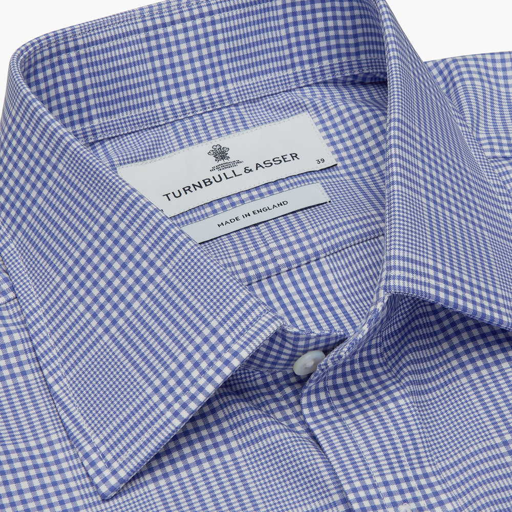 The Turnbull & Asser Blue Check Shirt features a T&A collar, 3-button cuffs, and a tonal blue check pattern in royal cotton twill. This long-sleeved, regular fit shirt is displayed on a white background.