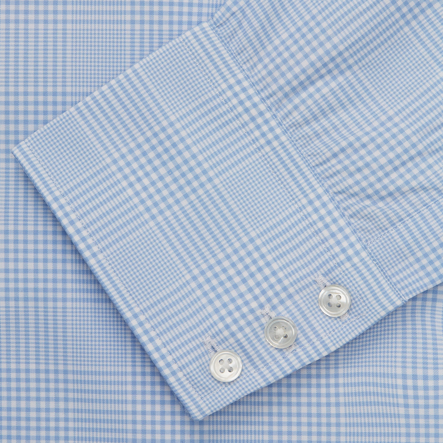 View 5 of product The Turnbull & Asser Pale Blue Check Shirt features a T&A collar, 3-button cuffs, and a subtle tonal check in royal cotton twill. It’s long-sleeved, regular fit, and shown flat on a white background.