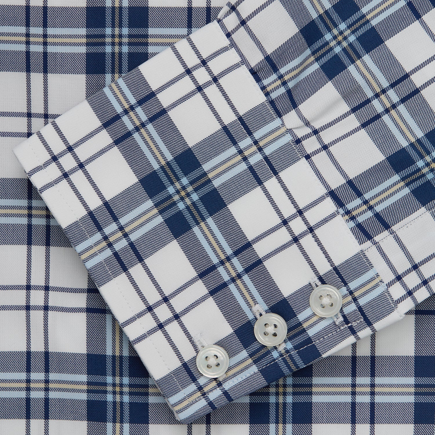 View 5 of product The Turnbull & Asser Blue Check Shirt features a T&A collar and 3-button cuffs, shown laid flat against a white background.