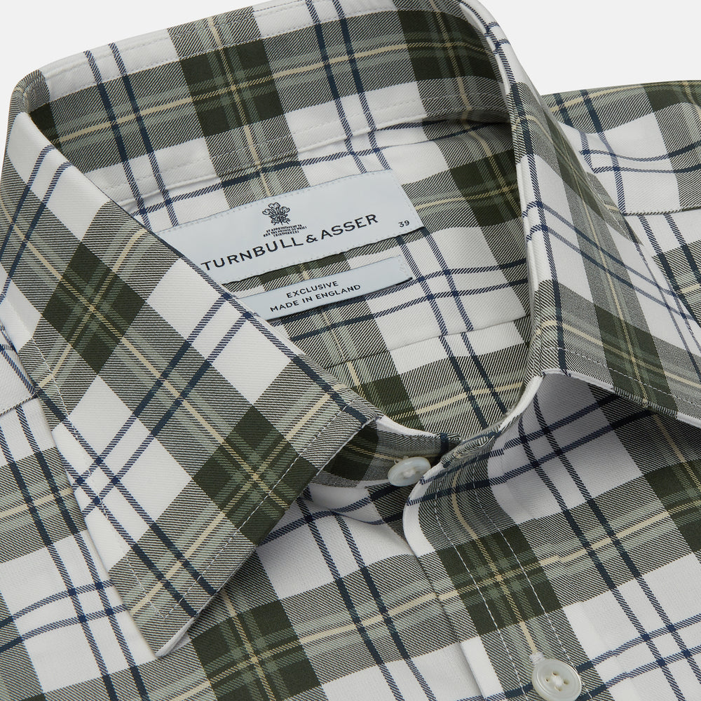 The Turnbull & Asser Green Check Shirt features a classic T&A collar, white buttons down the front and on 3-button cuffs, and a bold green, white, and black plaid pattern.