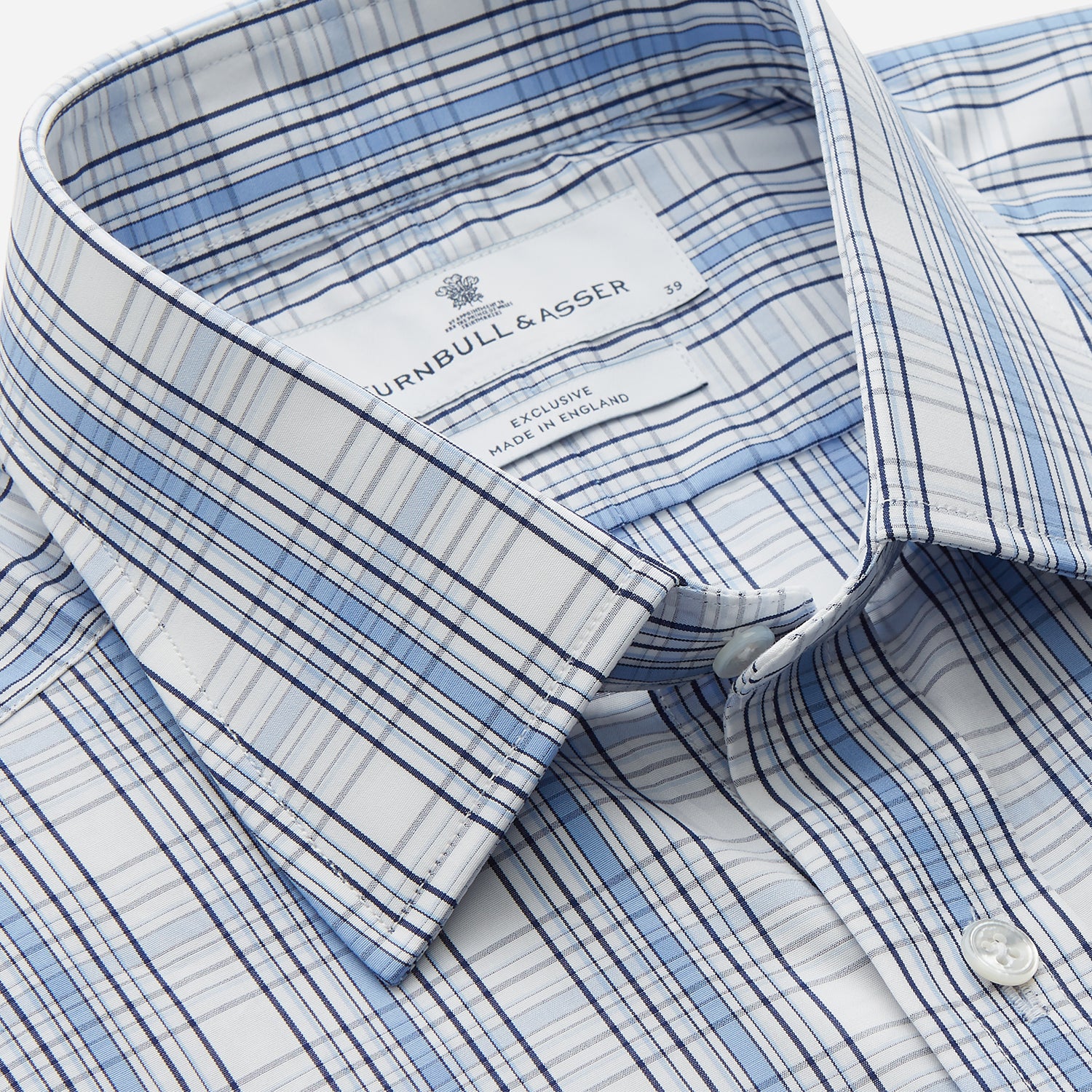 View 2 of product The Turnbull & Asser Tonal Blue Check Regular Fit Shirt with T&A collar and 3-button cuffs is displayed flat on a white background, highlighting its blue and white plaid pattern and long sleeves.