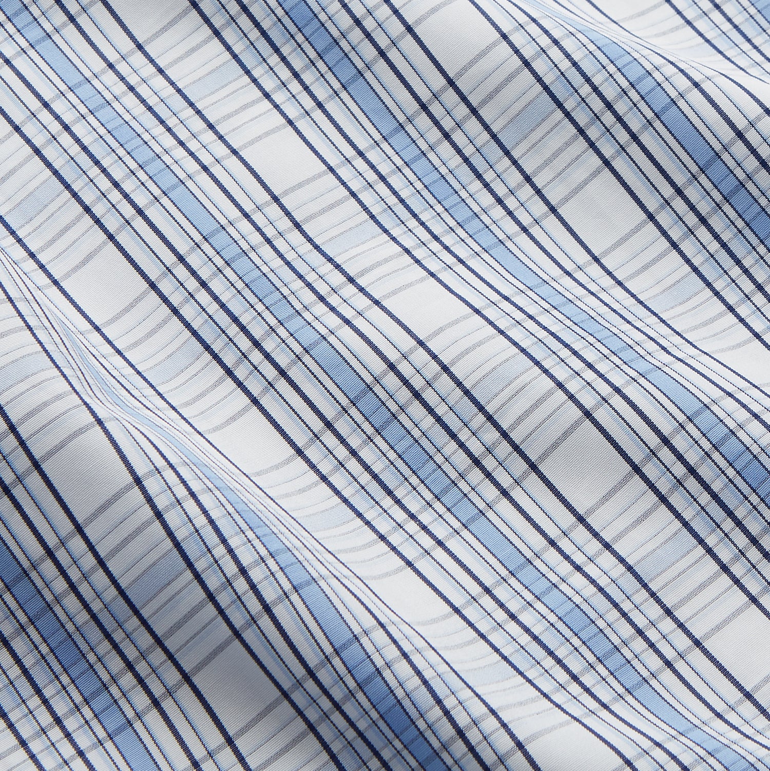 View 4 of product The Turnbull & Asser Tonal Blue Check Regular Fit Shirt with T&A collar and 3-button cuffs is displayed flat on a white background, highlighting its blue and white plaid pattern and long sleeves.