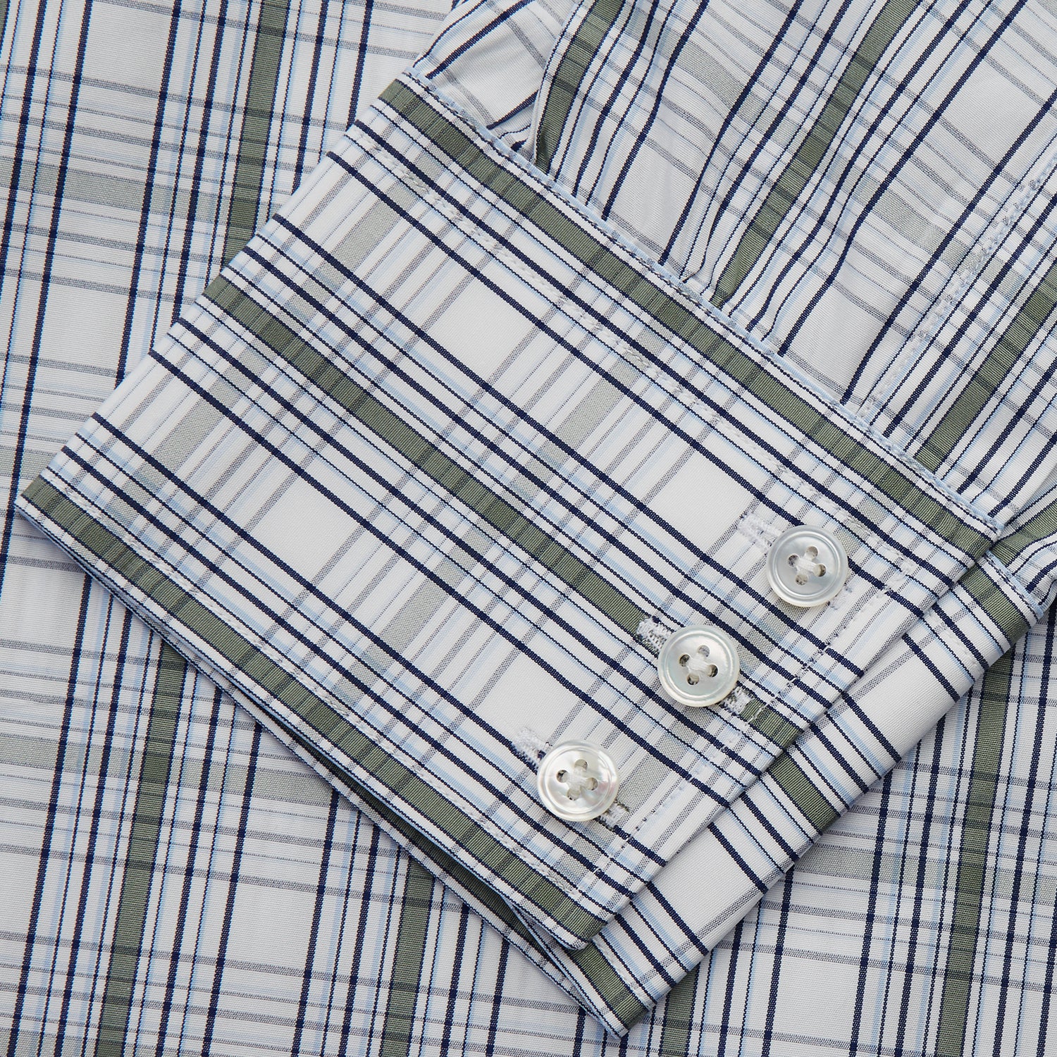 View 3 of product The Tonal Green Check Regular Fit Shirt by Turnbull & Asser features a T&A collar, 3-button cuffs, and a blue and white plaid pattern, crafted from Italian cotton poplin. Displayed on a white background.