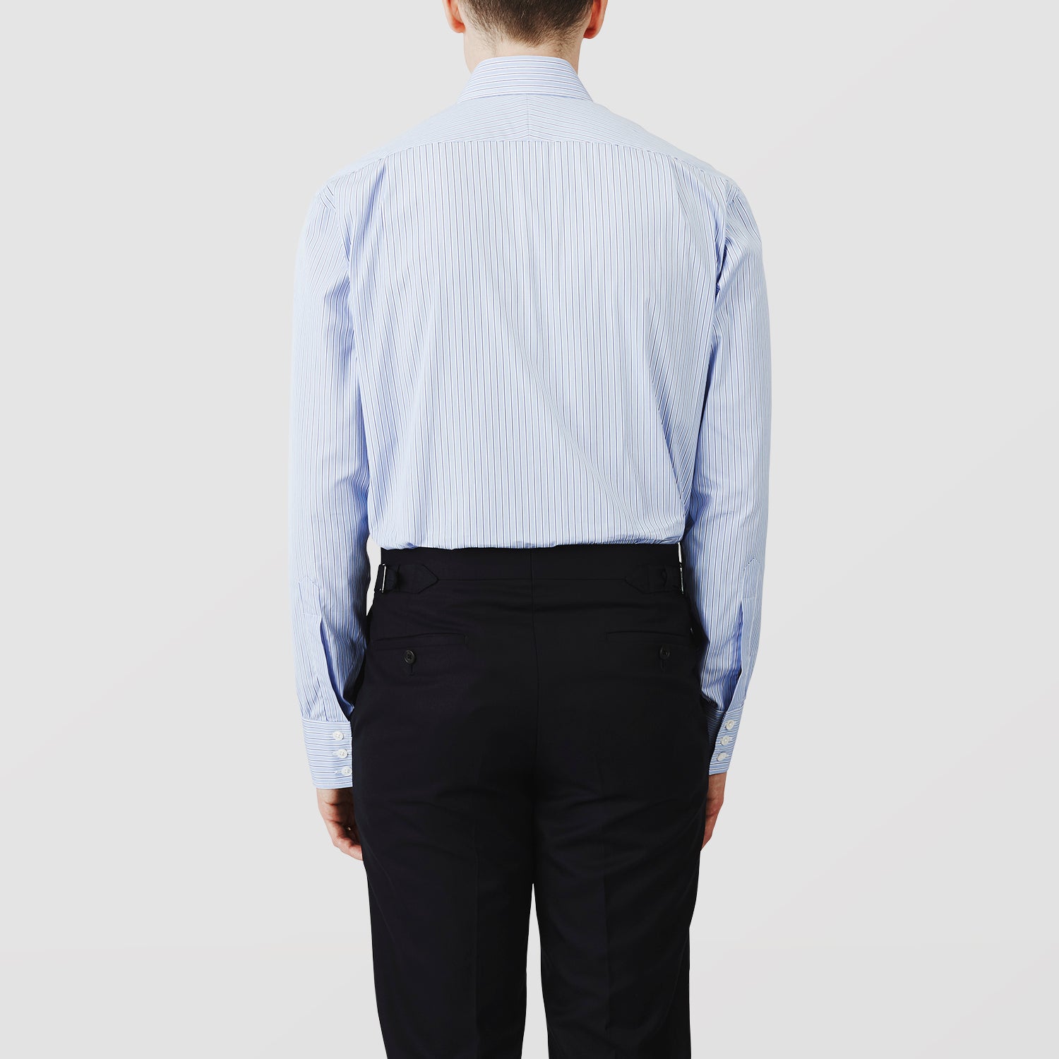 View 3 of product Turnbull & Asser’s Blue Stripe Shirt features thin vertical white stripes, a T&A collar, 3-button cuffs, white buttons, and a regular fit. Smart-casual style displayed flat on a white background.
