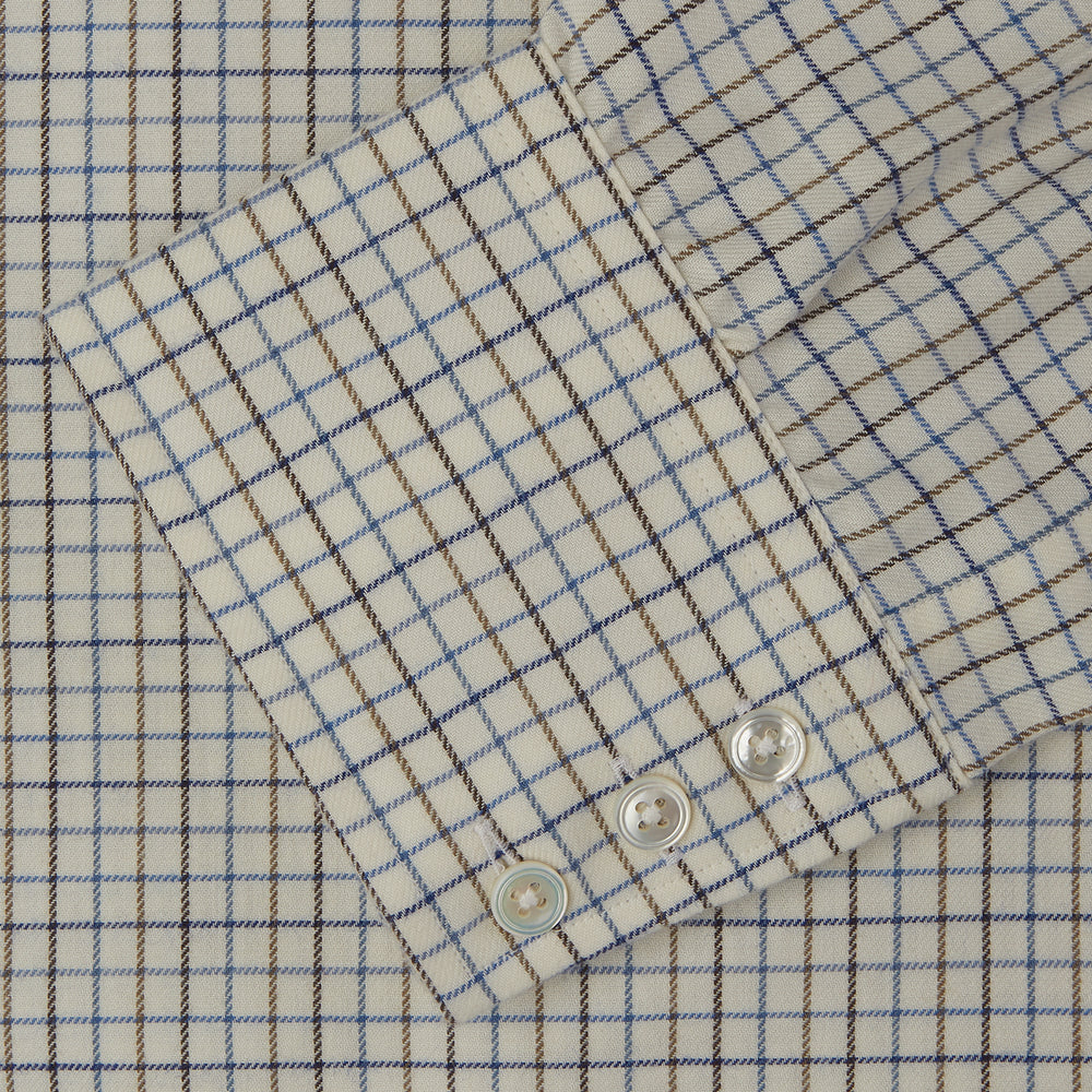 The Turnbull & Asser Blue Multi Check Cotton-Cashmere Shirt features a T&A collar, 3-button cuffs, and white buttons. Its smart-casual design showcases light blue, green, and beige checks on a white background.
