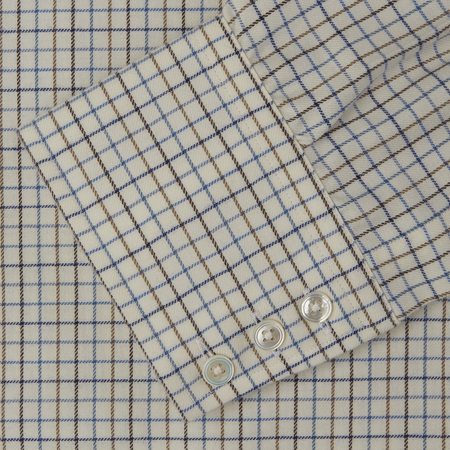 View 3 of product The Turnbull & Asser Blue Multi Check Cotton-Cashmere Shirt features a T&A collar, 3-button cuffs, and white buttons. Its smart-casual design showcases light blue, green, and beige checks on a white background.