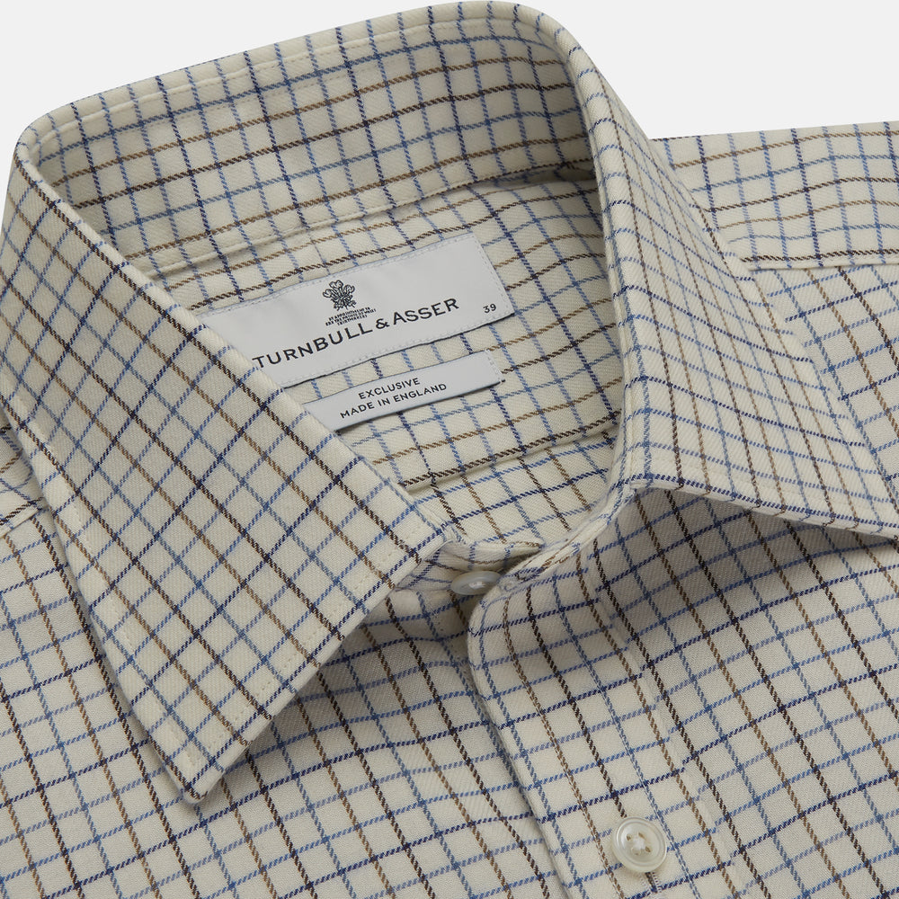The Turnbull & Asser Blue Multi Check Cotton-Cashmere Shirt features a T&A collar, 3-button cuffs, and white buttons. Its smart-casual design showcases light blue, green, and beige checks on a white background.