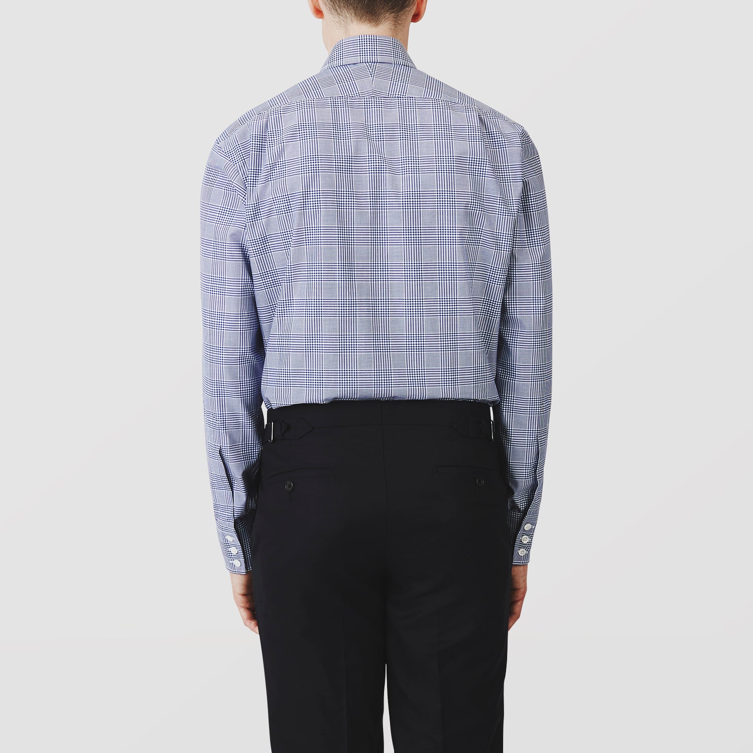 View 3 of product The Turnbull & Asser Navy Check Shirt, featuring a T&A collar and 3-button cuffs, is displayed on a white background.
