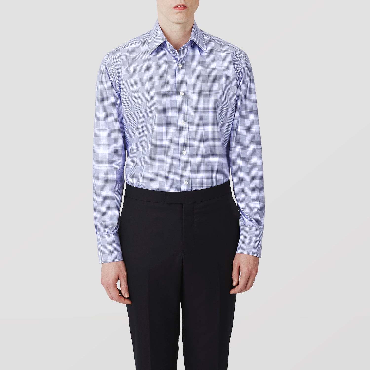View 2 of product The Turnbull & Asser Blue Check Shirt features a T&A collar, 3-button cuffs, and a tonal blue check pattern in royal cotton twill. This long-sleeved, regular fit shirt is displayed on a white background.