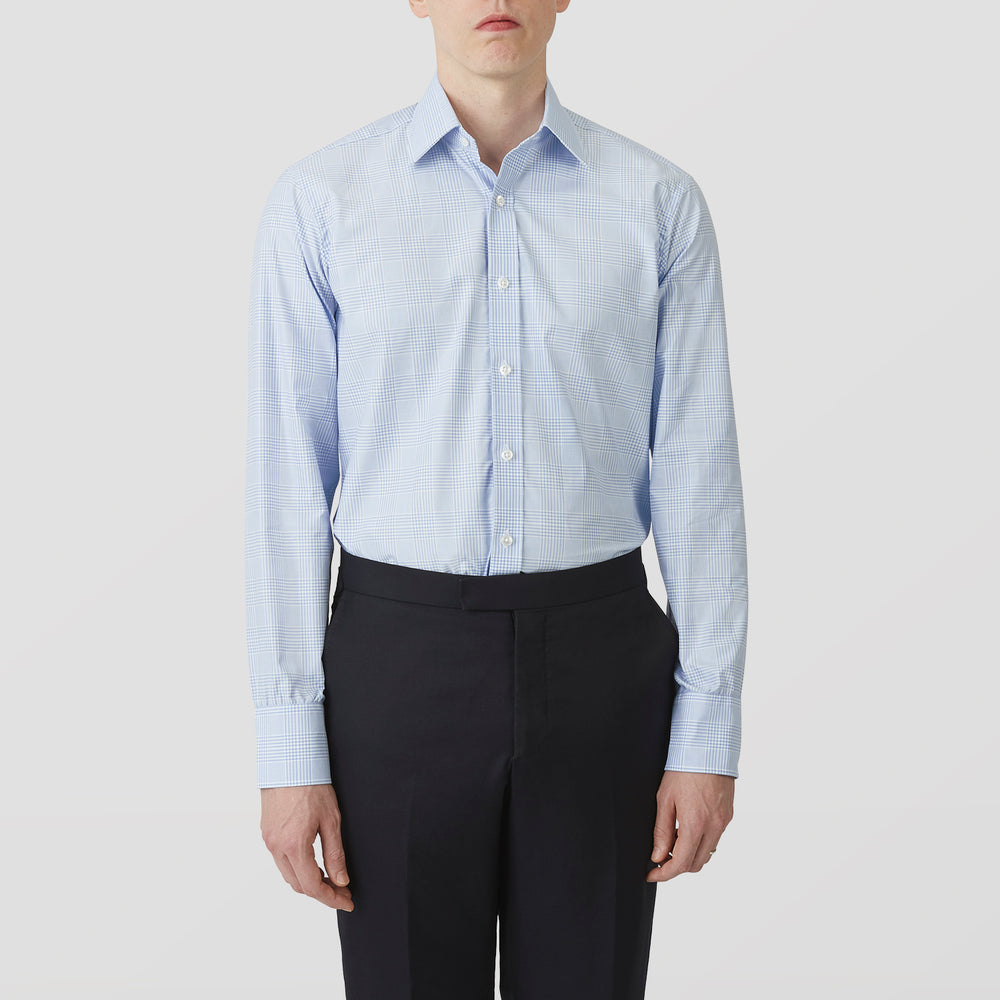 The Turnbull & Asser Pale Blue Check Shirt features a T&A collar, 3-button cuffs, and a subtle tonal check in royal cotton twill. It’s long-sleeved, regular fit, and shown flat on a white background.
