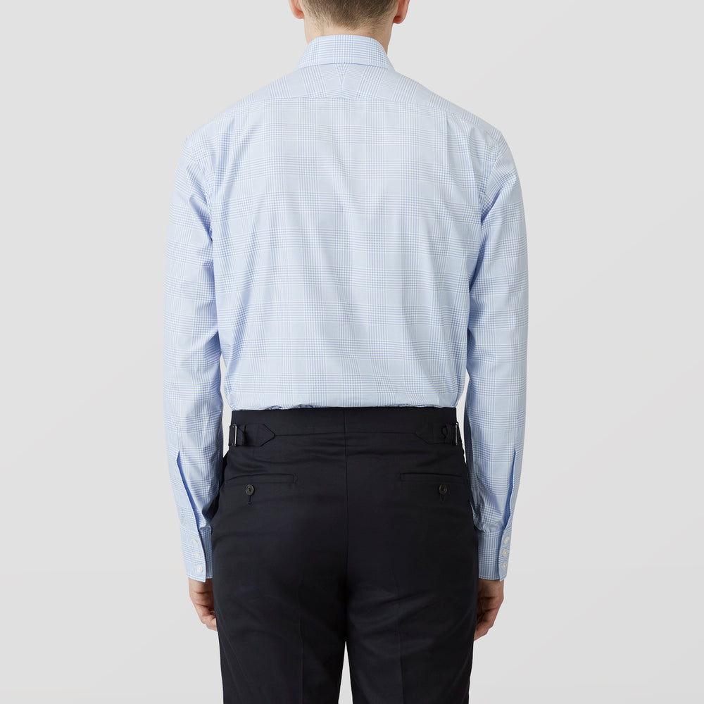 The Turnbull & Asser Pale Blue Check Shirt features a T&A collar, 3-button cuffs, and a subtle tonal check in royal cotton twill. It’s long-sleeved, regular fit, and shown flat on a white background.