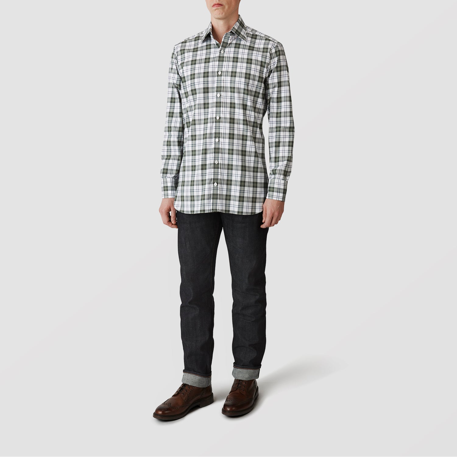 View 2 of product The Turnbull & Asser Green Check Shirt features a classic T&A collar, white buttons down the front and on 3-button cuffs, and a bold green, white, and black plaid pattern.