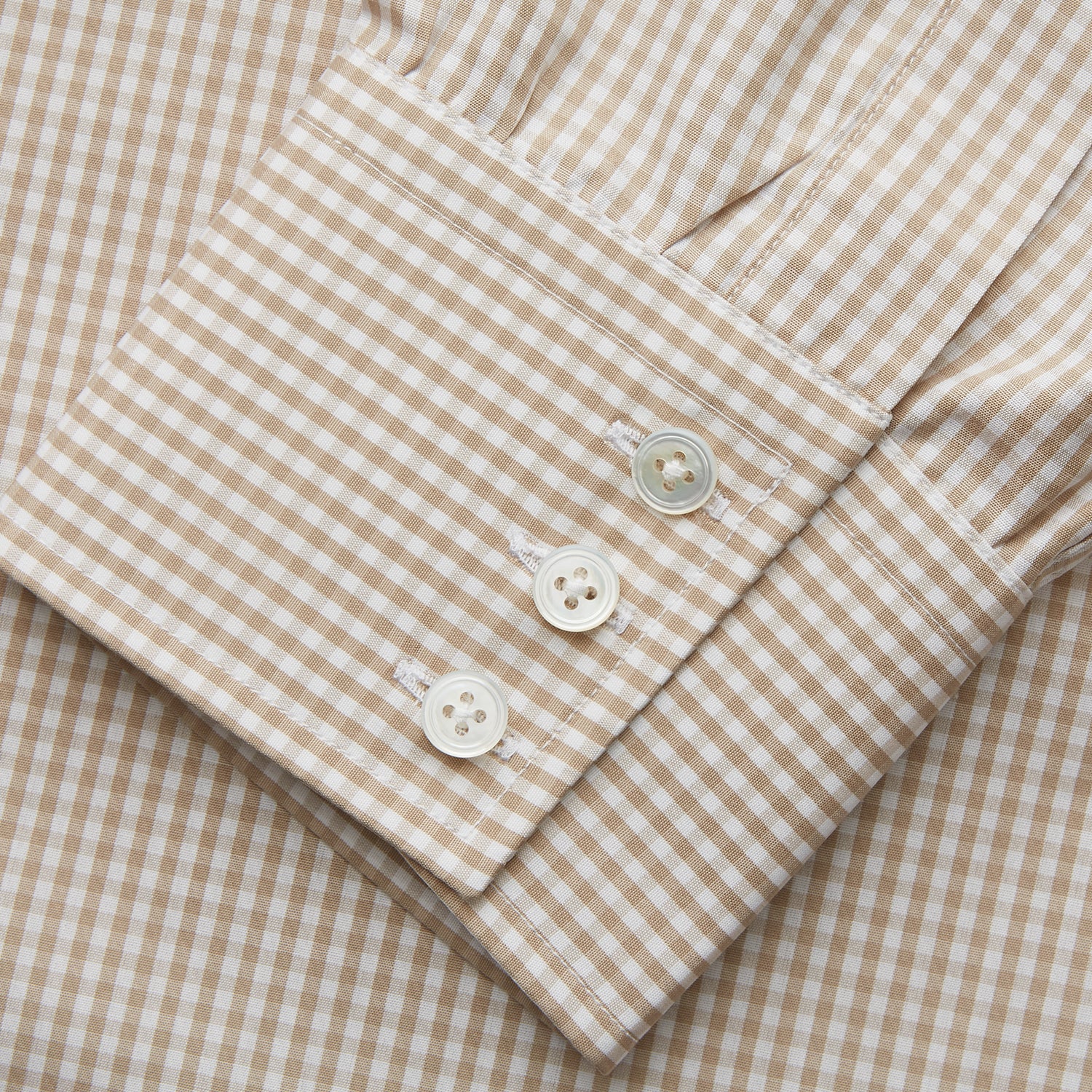 View 3 of product The Sand Gingham Check Regular Fit Shirt by Turnbull & Asser features a T&A collar, 3-button cuffs, and a sand gingham check pattern on white.