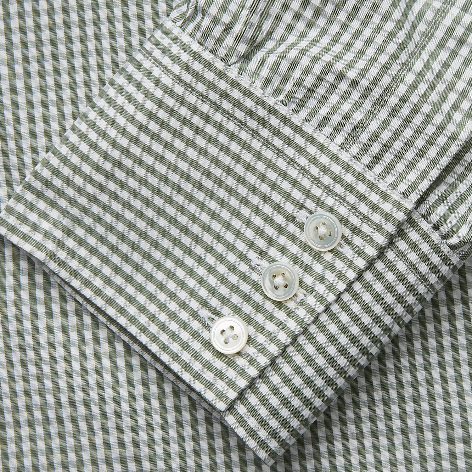 View 3 of product The Turnbull & Asser Green Gingham Check Regular Fit Shirt features a classic T&A collar and 3-button cuffs, displayed on a plain white background.