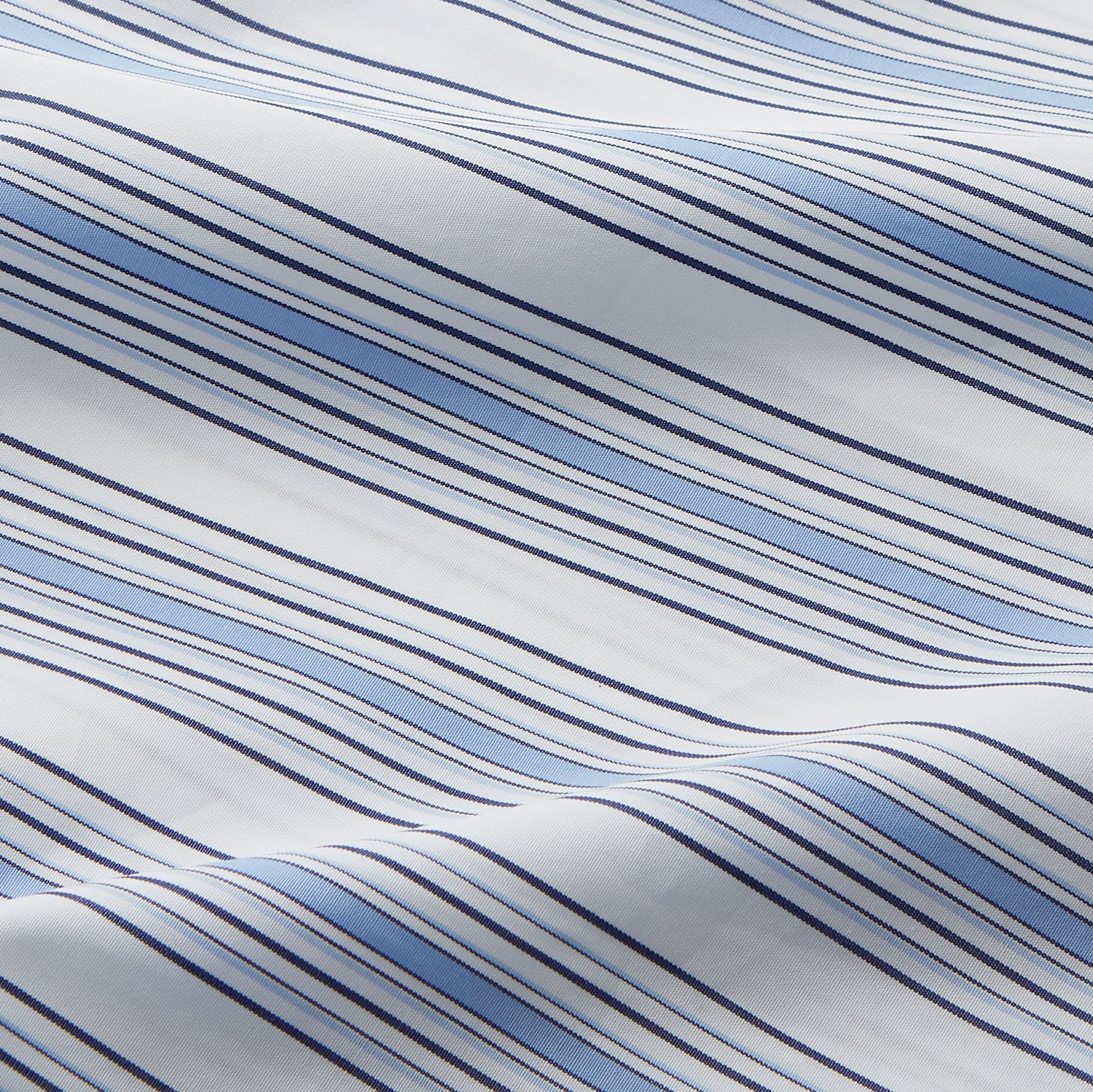 View 4 of product The Turnbull & Asser Blue Multi Stripe Regular Fit Shirt features a classic T&A collar, long sleeves, button-down front, and 3 button cuffs. Shown laid flat against a white background.