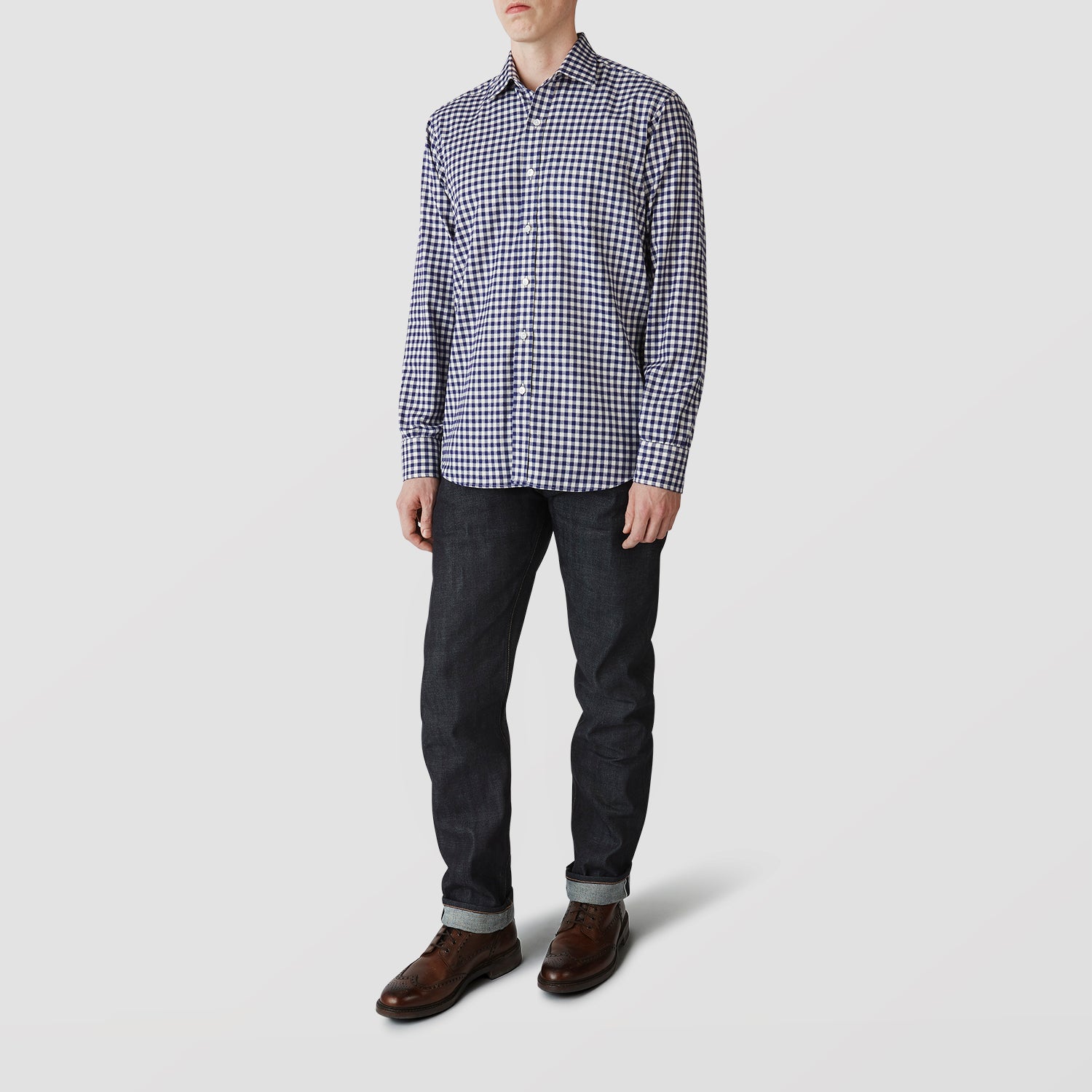View 2 of product The Turnbull & Asser Blue Check Weekend Fit Shirt features a Derby collar and 1-button cuffs—ideal for winter layering. Shirt is laid flat on a white background.