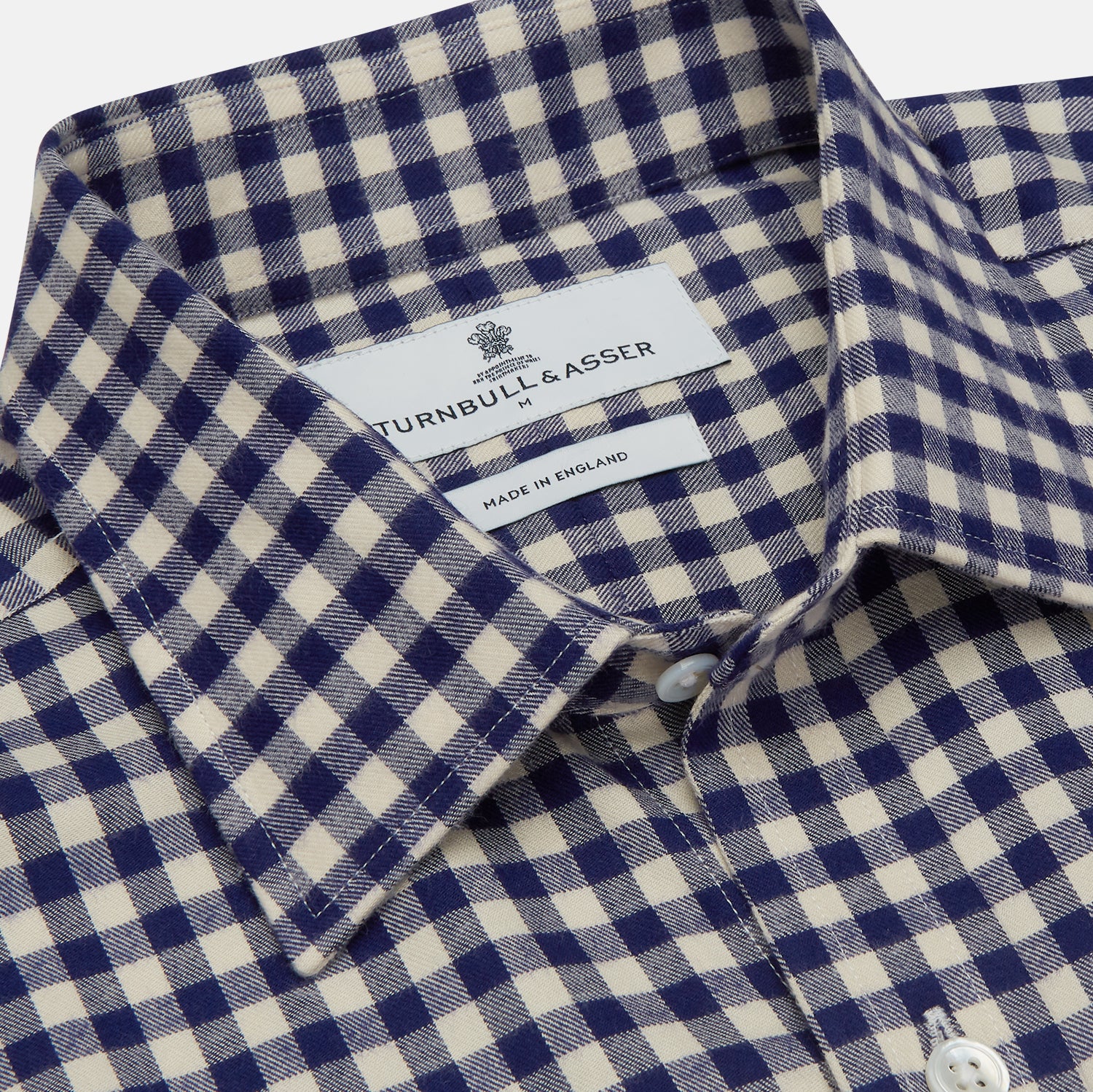 View 4 of product The Turnbull & Asser Blue Check Weekend Fit Shirt features a Derby collar and 1-button cuffs—ideal for winter layering. Shirt is laid flat on a white background.