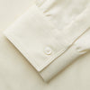 View 3 of product The Cream Herringbone Fine Cotton Weekend Officer Fit Shirt by Turnbull & Asser features a Dorset collar, long sleeves, two button-flap chest pockets, and buttoned cuffs—perfect for smart-casual style.
