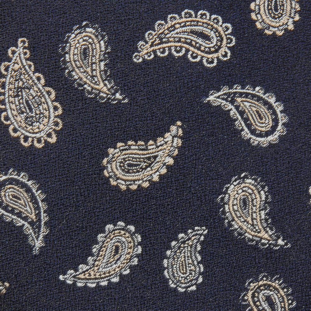 The Black Renoir Paisley Tie by Turnbull & Asser features intricate paisley patterns, making it a sophisticated addition to any outfit.