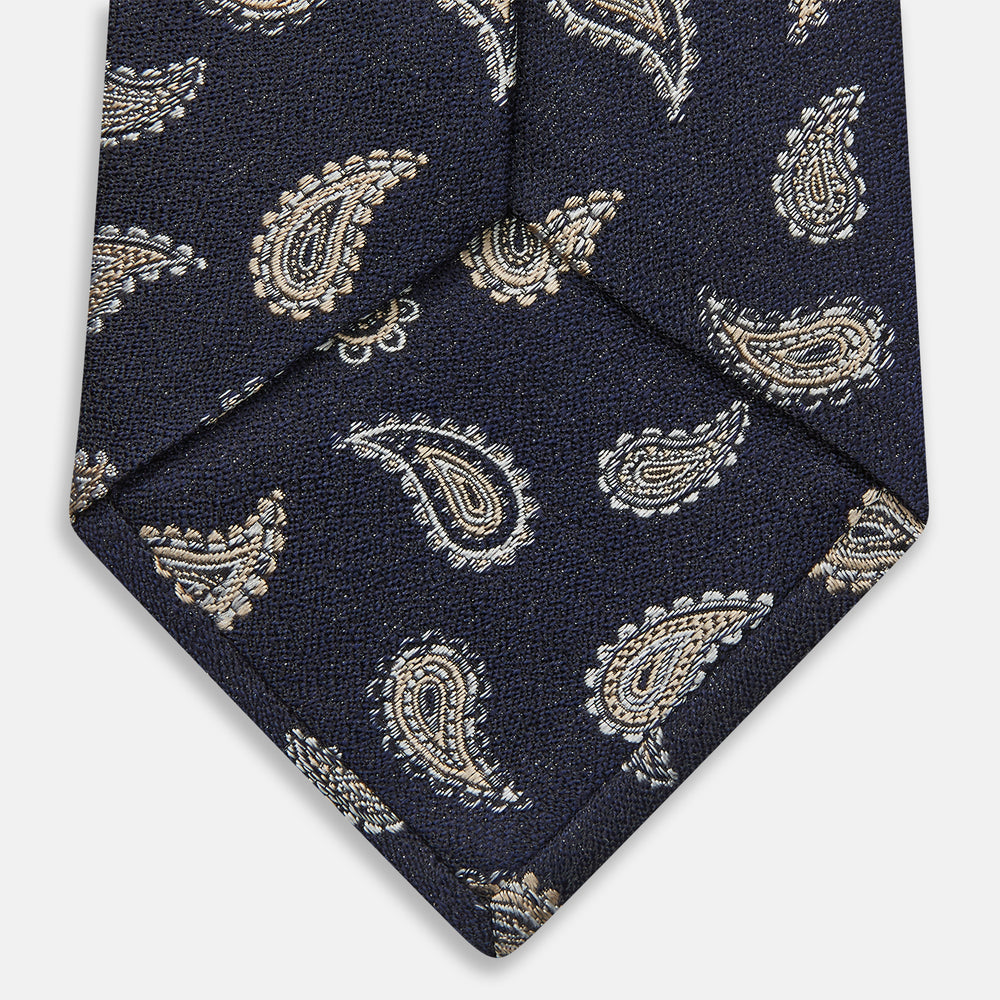 The Black Renoir Paisley Tie by Turnbull & Asser features intricate paisley patterns, making it a sophisticated addition to any outfit.
