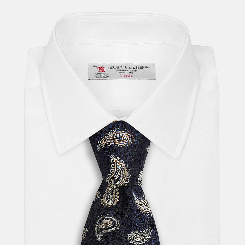 The Black Renoir Paisley Tie by Turnbull & Asser features intricate paisley patterns, making it a sophisticated addition to any outfit.